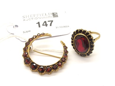 Lot 147 - A Garnet Set Crescent Brooch, graduated...