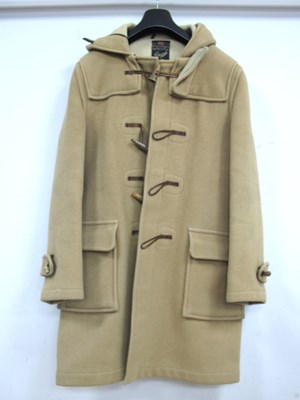 Lot 1377 - A Beige Gloverall Duffel Coat, with leather...