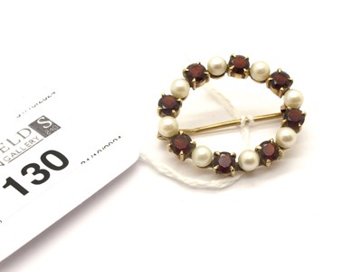 Lot 130 - A Garnet and Pearl Oval Circlet Brooch, claw...