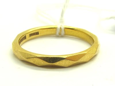 Lot 227 - A 22ct Gold Geometric Band, of faceted design...