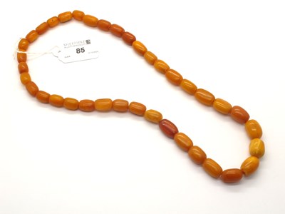 Lot 85 - A Graduated Single Strand Amber Colour Bead...