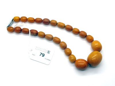 Lot 79 - A Graduated Single Strand Amber Colour Bead...