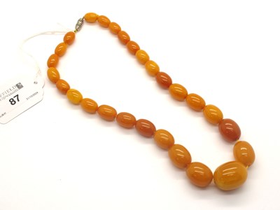 Lot 87 - A Graduated Single Strand Amber Colour Bead...