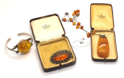 Lot 83 - An Art Deco Style Amber Colour Pendant, the...