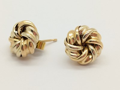 Lot 64 - A Pair of Two-Tone Knotted Earstuds, of...