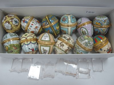 Lot 1289 - Halcyon Days Enamelled Easter Eggs, complete...