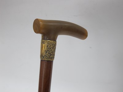 Lot 1328 - Horn Handled Walking Cane, with yellow metal...