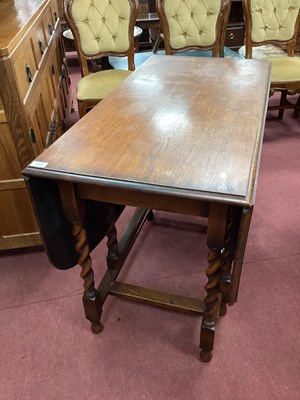 Lot 1568 - 1930s Oak Gate Leg Table, with drop leaves, on...