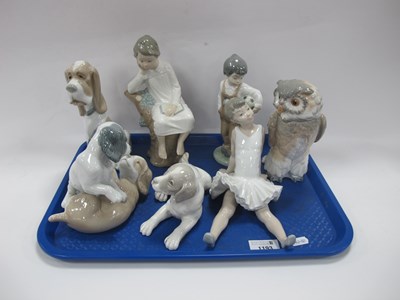 Lot 1193 - Nao Figurines - three dog groups, footballer,...