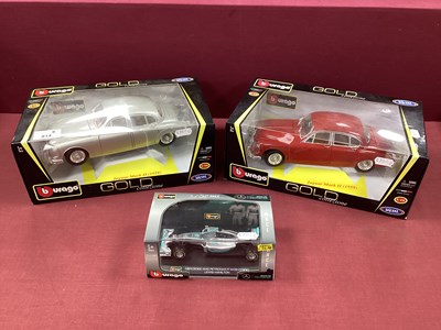 Lot 814 - Three Diecast Model Cars by Burago to include...