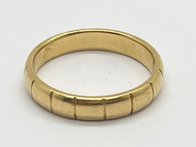 Lot 37 - A Wedding Band Ring, with line decoration...