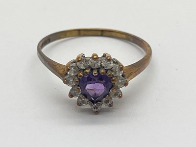 Lot 25 - A 9ct Gold Stone Set Cluster Ring, the heart...