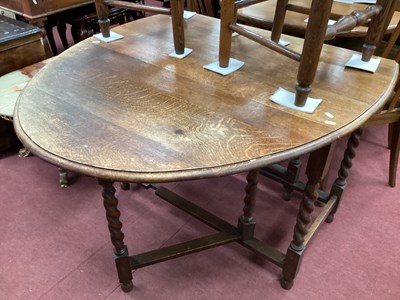 Lot 1538 - 1930s Oak Gate Leg Table, top with a moulded...