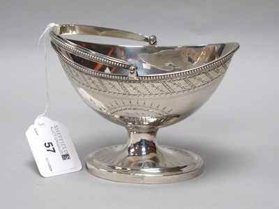 Lot 57 - A Georgian Hallmarked Silver Swing Handled...