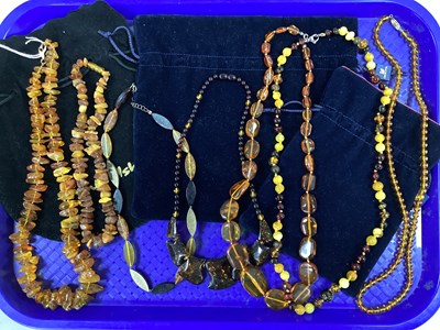 Lot 233 - Assorted Amber Coloured Necklaces, including...