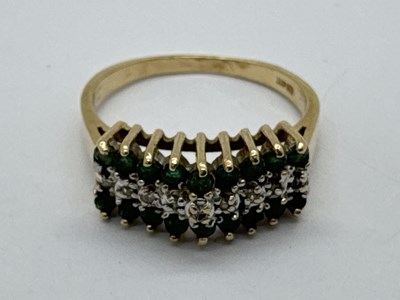 Lot 91 - A Diamond and Emerald Set Dress Ring, of three...