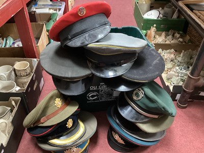 Lot 1112 - A large collection of hats many military...