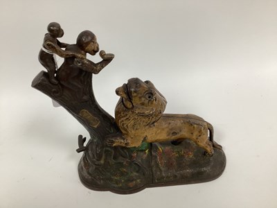 Lot 1297 - A Painted Cast Iron Money Box, cast as a lion...