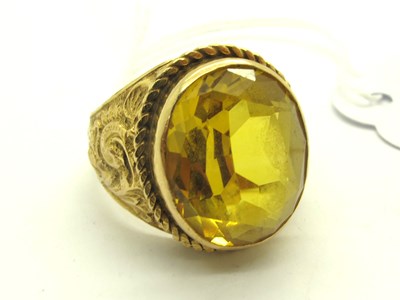 Lot 215 - A Single Stone College Style Ring, oval collet...