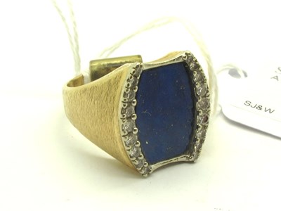 Lot 236 - A Lapis Lazuli Panel Ring, the shaped...