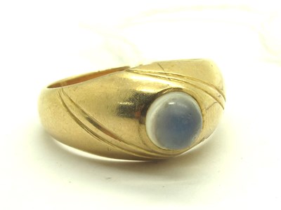 Lot 237 - A Cabochon Moonstone Set Ring, the collet set...