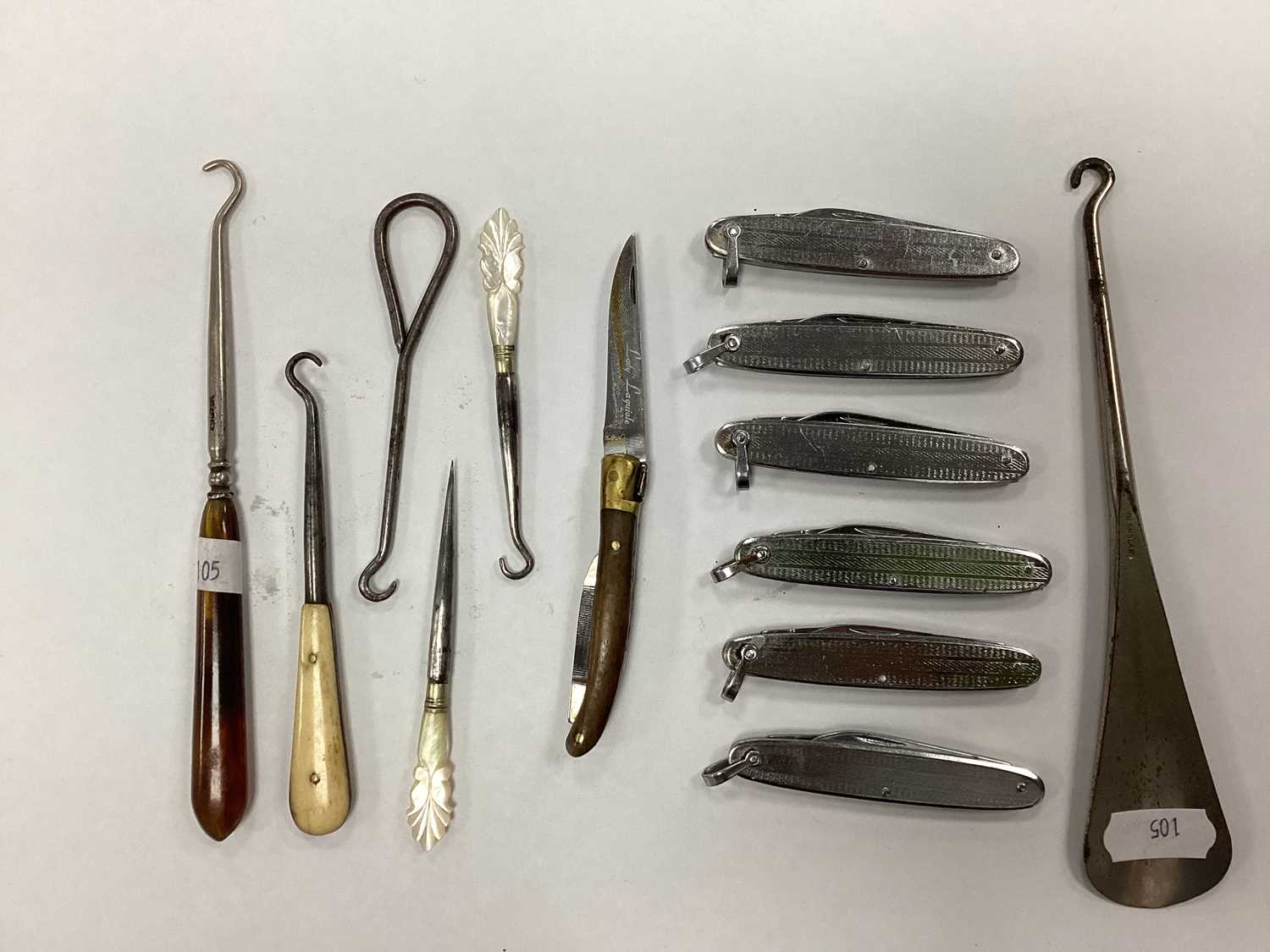 Lot 1279 - Button Hooks, pen knives, lady laguiole pen...