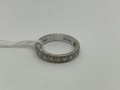 Lot 526 - A Diamond Set Half Eternity Band, set with...