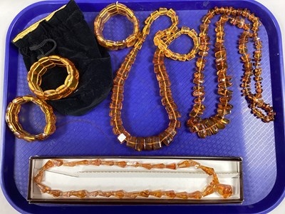 Lot 253 - A Collection of Amber Coloured Jewellery, to...