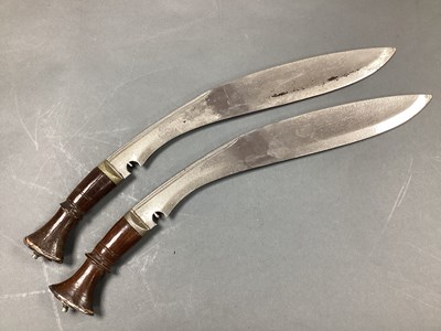 Lot 498 - Two Kukri Knives, discolouration to blades and...