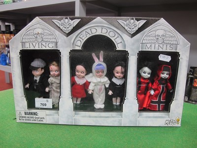 Lot 769 - A Boxed Set of Seven Living Dead Doll Minis by...