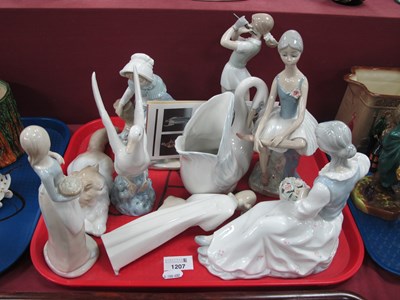 Lot 1207 - Nao figurines to include lady playing golf,...