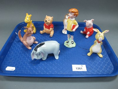 Lot 1261 - Beswick Winnie the Pooh figurines to include...