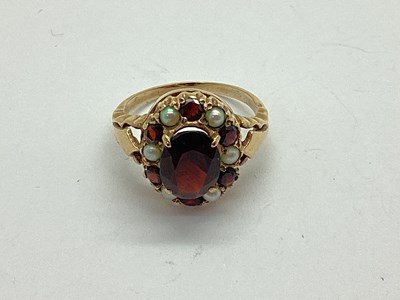 Lot 105 - A Vintage Garnet and Seed Pearl Dress Ring, of...