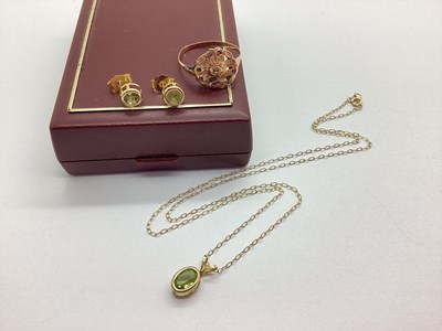 Lot 71 - A Dainty Peridot Set Pendant, oval rubover set,...