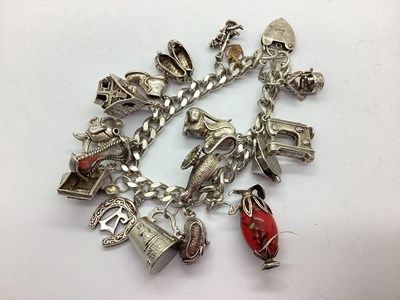 Lot 124 - A Vintage Chunky Curb Link Charm Bracelet,...