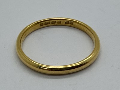 Lot 110 - A 22ct Gold Plain Slim Wedding Band Ring,...