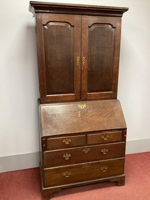 Lot 1485 - A Georgian Oak Bureau Bookcase, with twin...