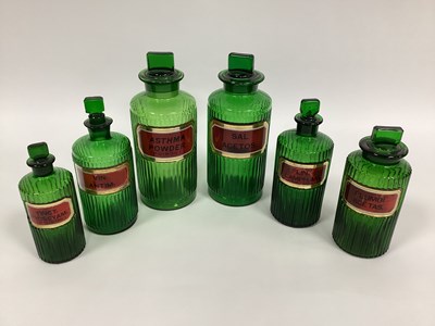 Lot 1300 - Six Late XIX Century Green Glass Pharmacy...