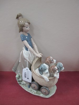 Lot 1220 - Lladro Figure 'Litter of Fun', girl with...