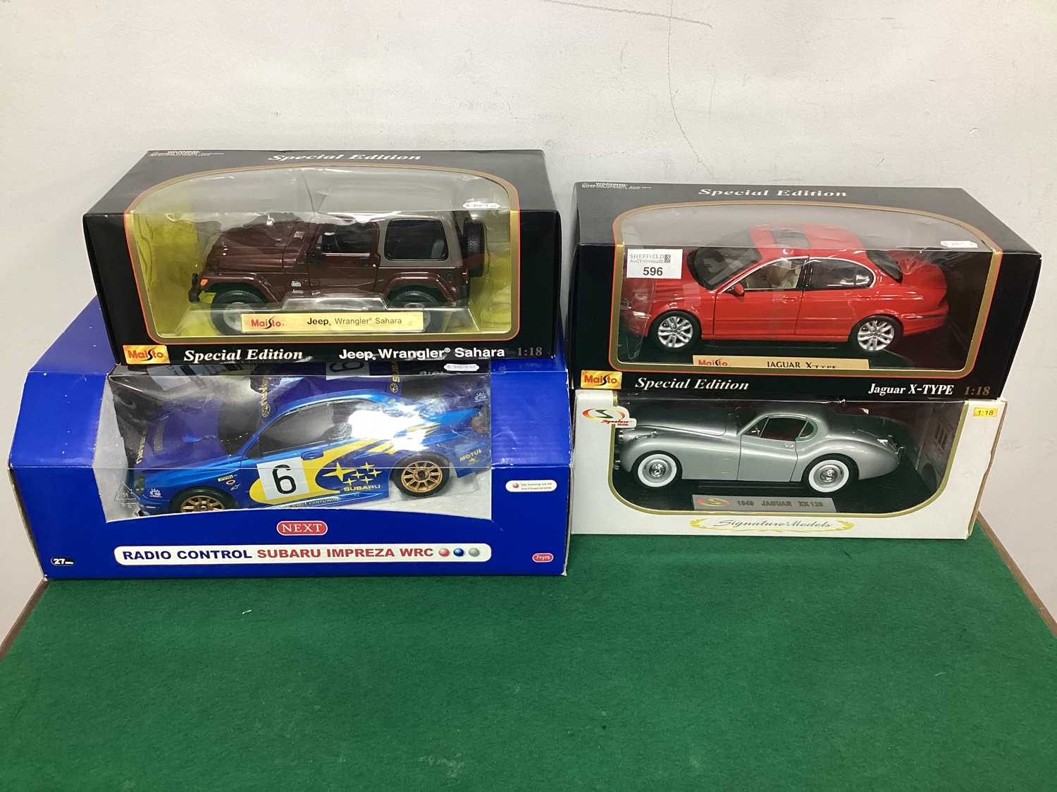 Lot 596 - Three 1:18th Scale Diecast Model Cars by