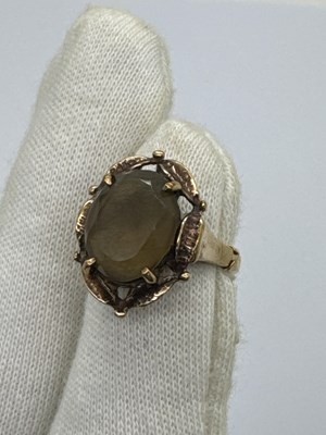 Lot 114 - A Vintage Stone Set Dress Ring, the oval stone...