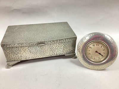 Lot 16 - A Tudric Pewter Bedside Clock, the engine...