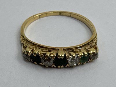 Lot 130 - A Vintage Seven Stone Ring, the claw set...