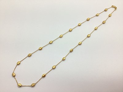 Lot 104 - A Modern 9ct Gold Beaded Necklace, the oval...