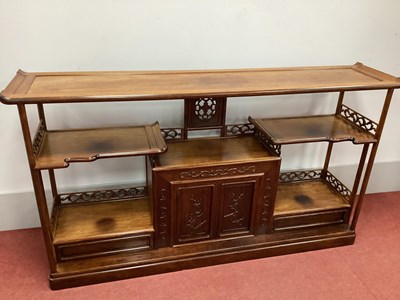 Lot 1587 - A Chinese Hardwood Etagére, with panelled top...