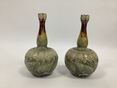 Lot 1066 - A Pair of Doulton Lambeth Stoneware Bottle...