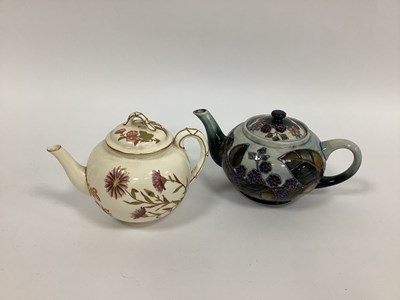 Lot 1111 - A Moorcroft Pottery teapot and Cover, of...