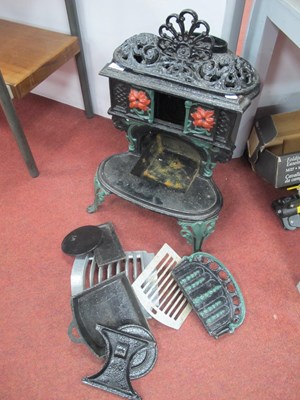 Lot 1366 - Iron Wood Burner, on scrooll feet, 44cm high.