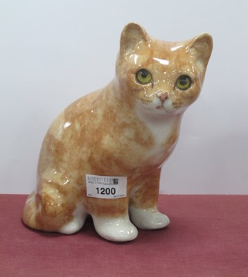 Lot 1200 - A Winstanley seated ginger tabby cat with...