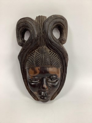 Lot 1128 - A 1950's Carved African Female Face Mask,...